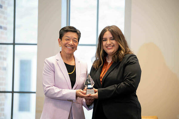 Washington Supreme Court Justice Mary Yu with award.