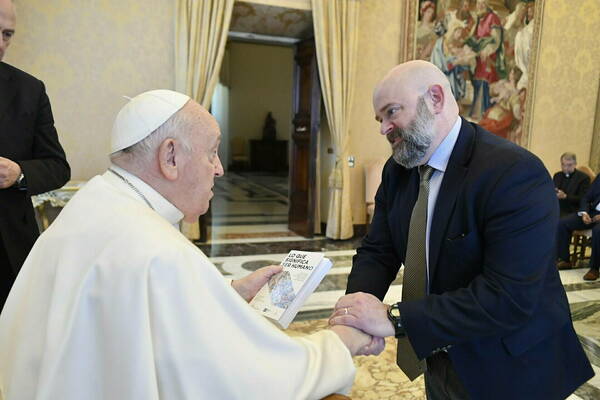 ND Law Charles E. Rice Professor of Law Carter Snead greeting Pope Francis