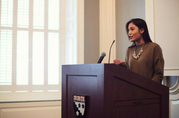 Arienne Calingo speaks at a poetry event at Harvard.