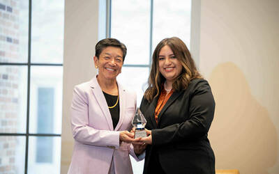 Washington Supreme Court Justice Mary Yu with award.