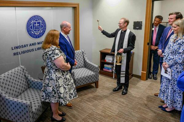 Notre Dame President Rev. Robert A. Dowd, C.S.C. blessing the newly renamed Lindsay and Matt Moroun Religious Liberty Clinic