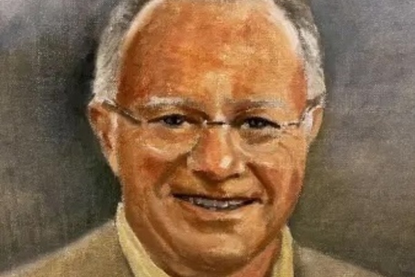 Portrait painting of a man with short gray hair and glasses wearing a tan jacket and pale yellow shirt, smiling against a gray background.