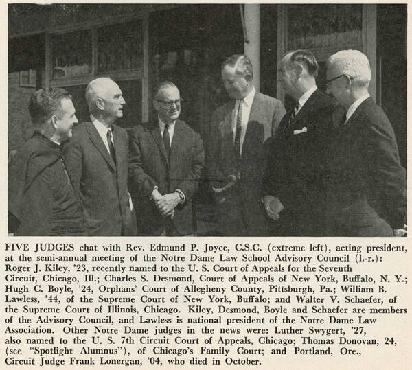 Rev. Edmund P. Joyce, C.S.C. chats with five judges, Roger J. Kiley, Charles S. Desmond, Hugh C. Boyle, William B. Lawless, and Walter V. Schaefer, at a Notre Dame Law School Advisory Council meeting. All six men are smiling in this black and white photo.